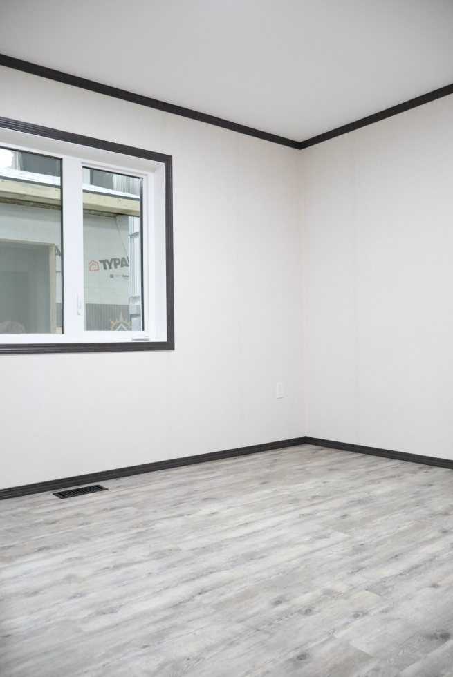 Bright bedroom inside The Cottage modular home