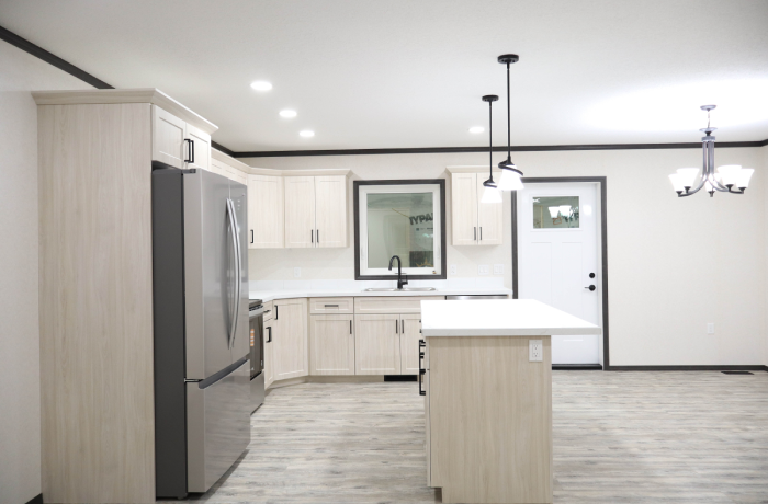 Modern kitchen featuring island and stainless steel appliances
