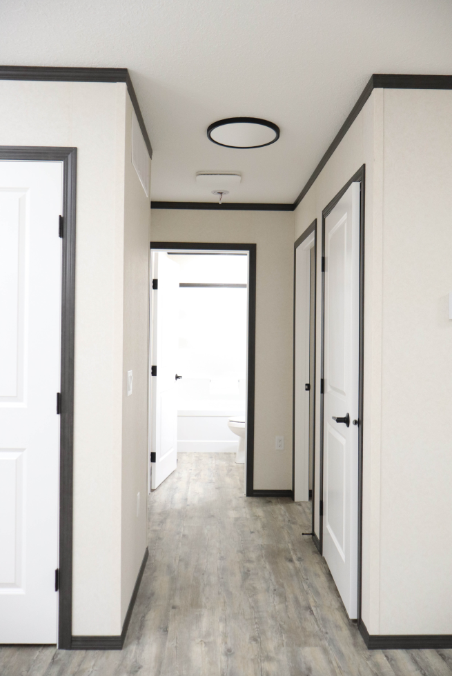 Interior hallway connecting rooms in The Cottage home