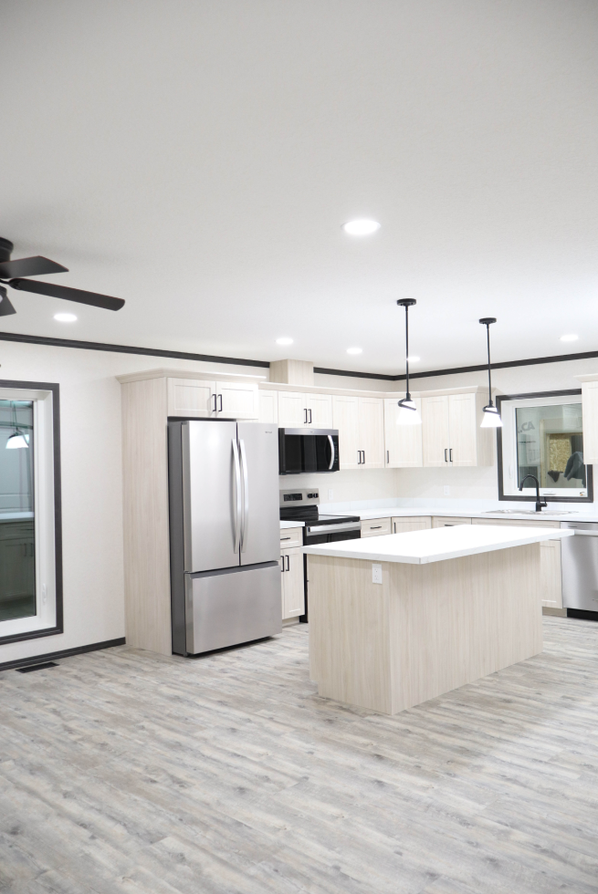 Modern kitchen and living space in The Cottage home
